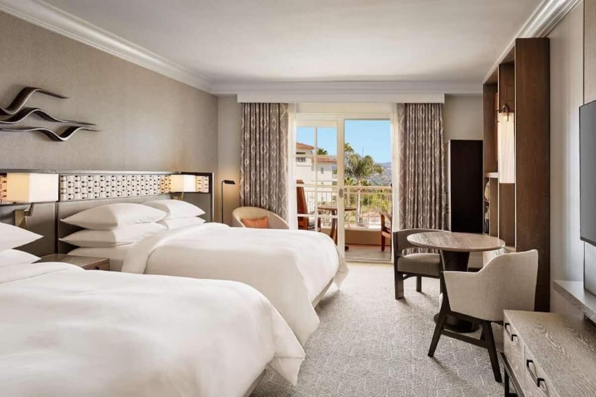 Premium bedding, down comforters, pillowtop beds, in-room safe