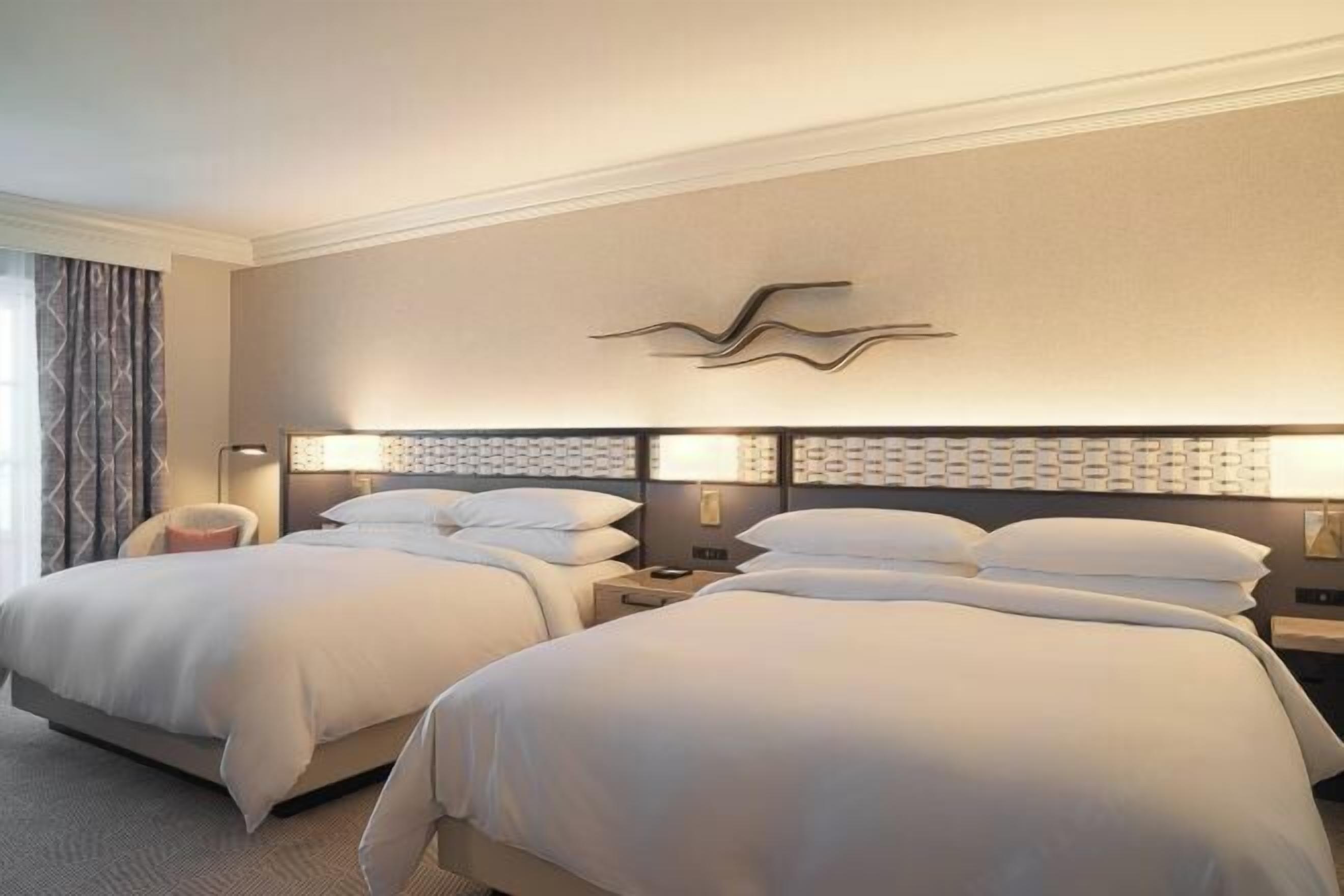 Premium bedding, down comforters, pillowtop beds, in-room safe