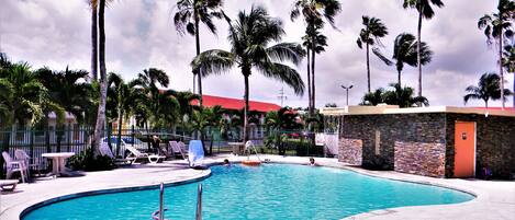 Outdoor pool, open 8:00 AM to 8:00 PM, pool loungers