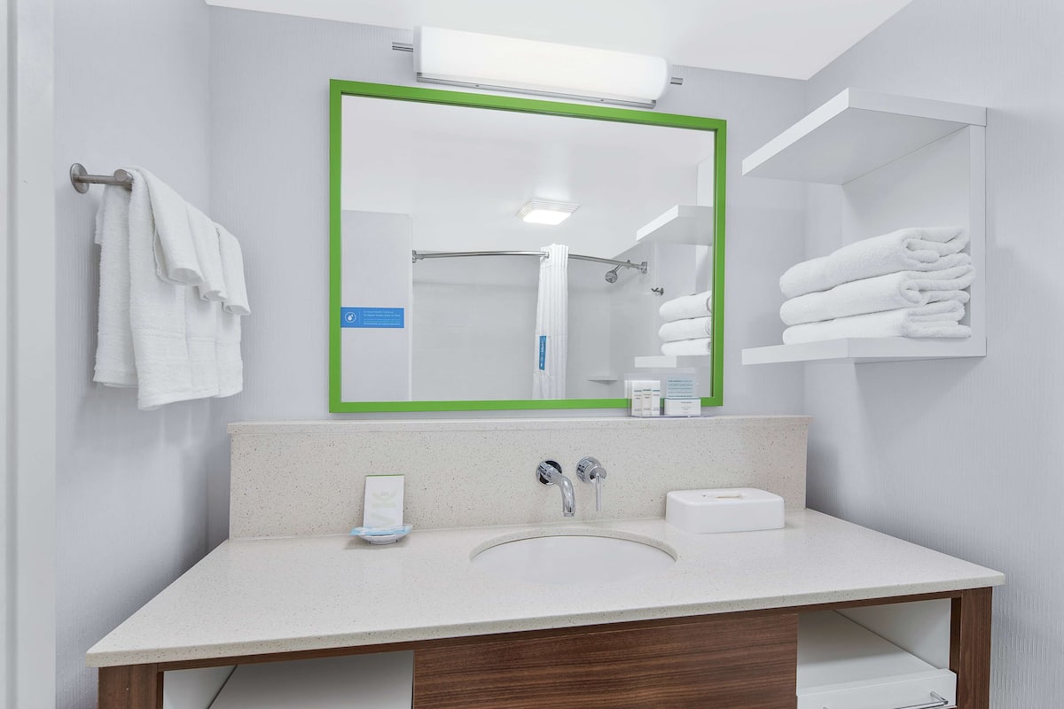 two queen bed non smoking | bathroom | shower, hair dryer, towels