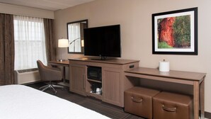 A hotel room with a bed, a desk with a flat-screen TV, a chair, a microwave, and a framed picture on the wall. - Hampton Inn Columbus/Taylorsville/Edinburgh (Edinburgh)