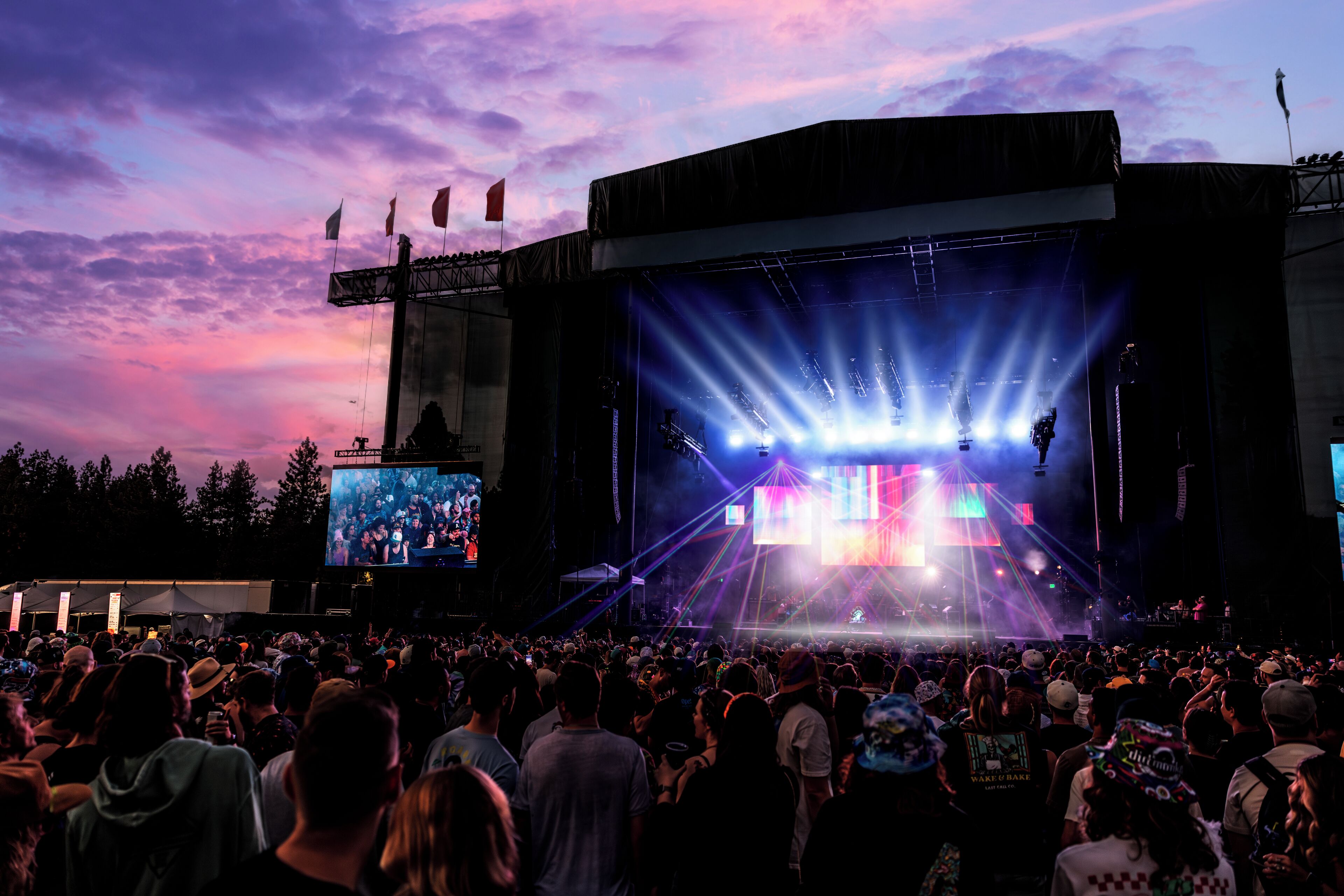 A large outdoor concert venue with a stage and audience.