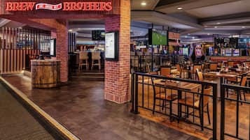 A restaurant named 'Brew Brothers' with a brick facade, bar area, and gaming machines.