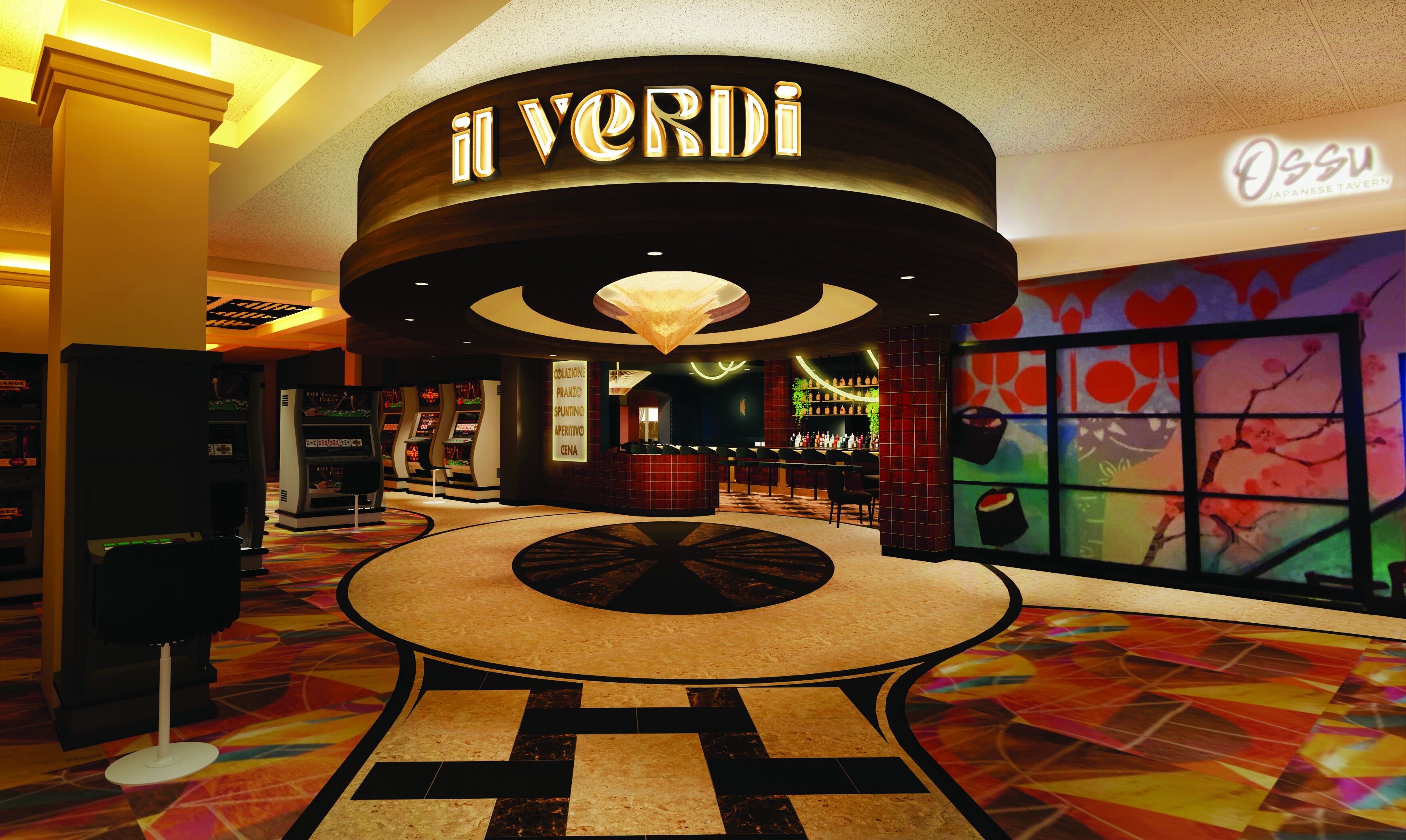 Um saguão de hotel com uma mesa redonda central, área de bar e um grande letreiro iluminado com a inscrição "Il Verdi".