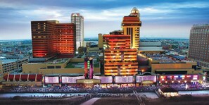 A hotel with a casino, a large outdoor area, and a view of the cityscape. - Tropicana Atlantic City – A Caesars Rewards Destination (Atlantic City)
