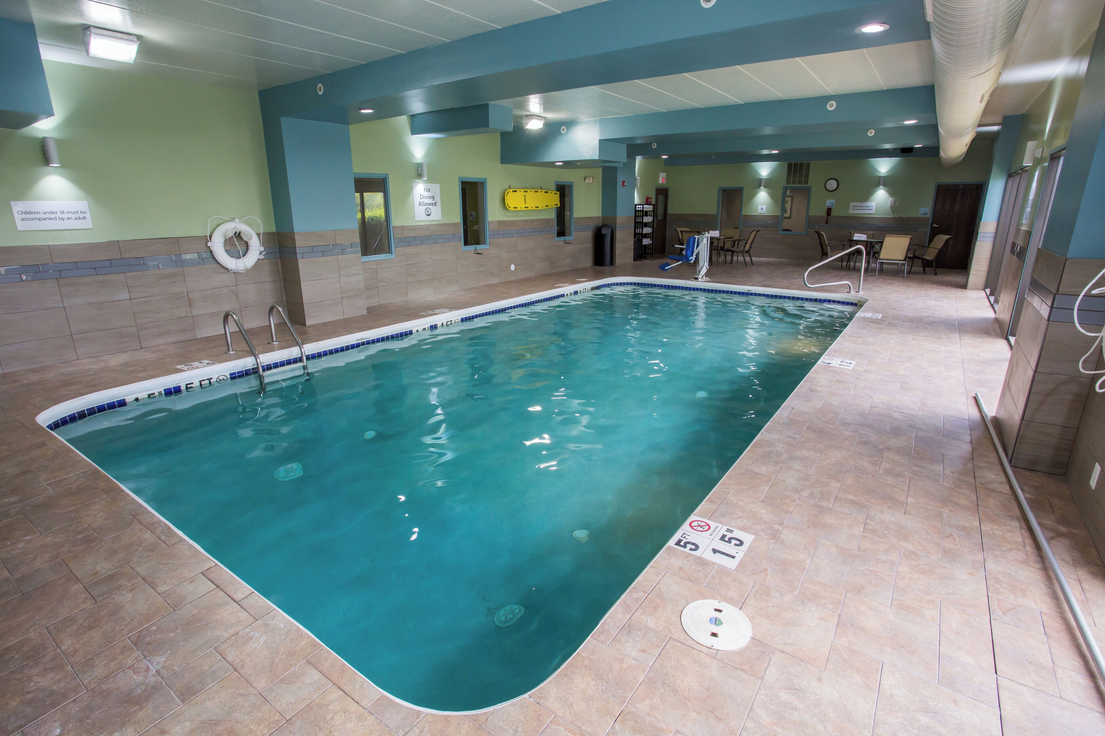 indoor pool, open 7:00 am to 11:00 pm, pool loungers, lifeguards on site
