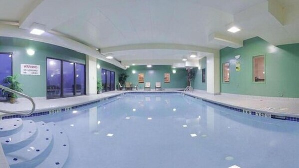 Indoor pool, open 7:00 AM to 11:00 PM, pool loungers, lifeguards on site