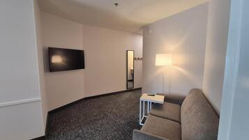 Suite, 1 Bedroom | Desk, blackout drapes, iron/ironing board, free cribs/infant beds
