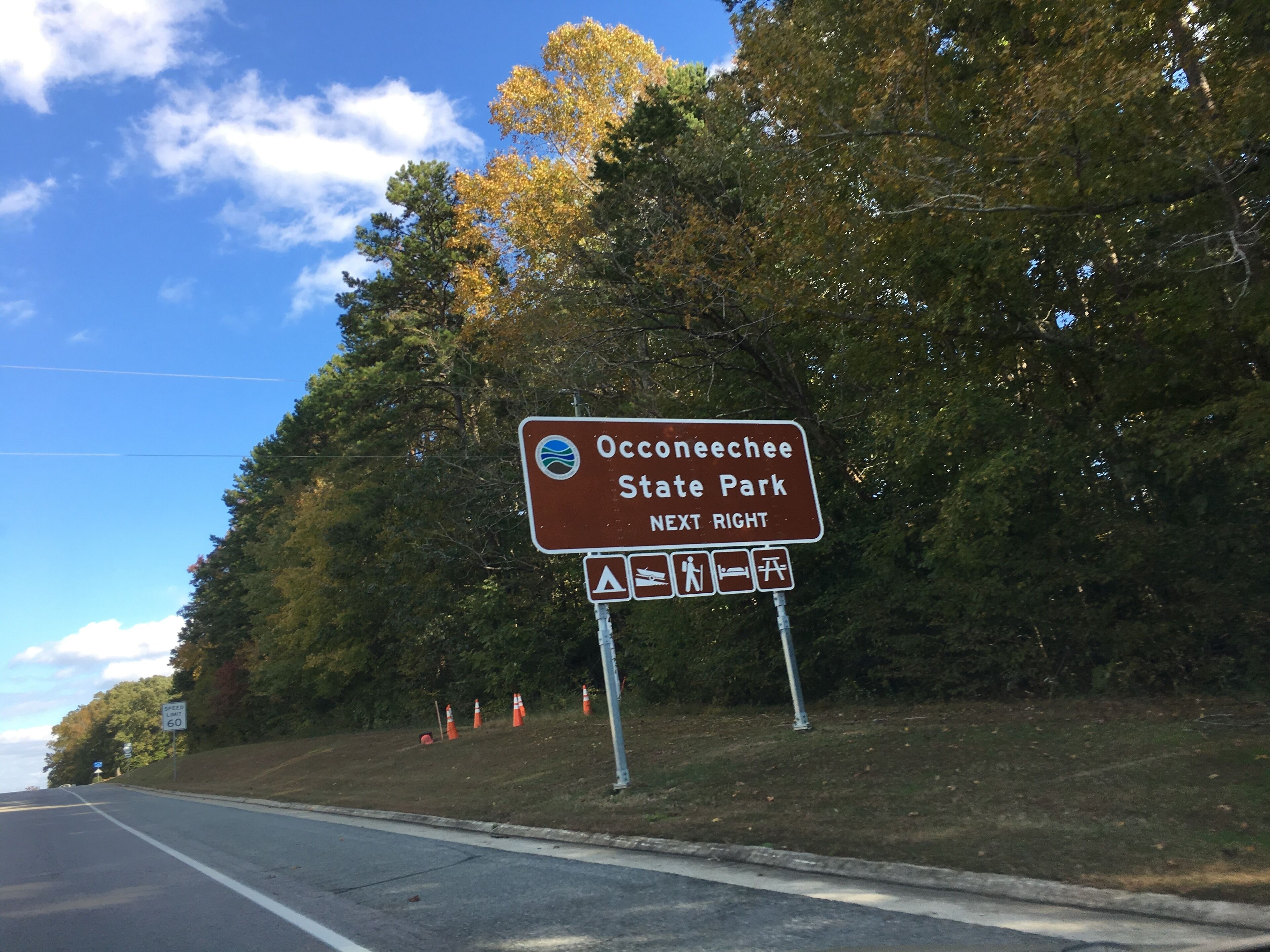 A road sign indicating Oconeechee State Park is next right.
