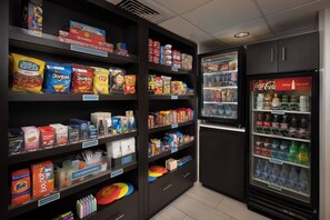 A self-service snack and beverage area with various food items and drinks. - Holiday Inn Express Middlesboro by IHG (Middlesboro)