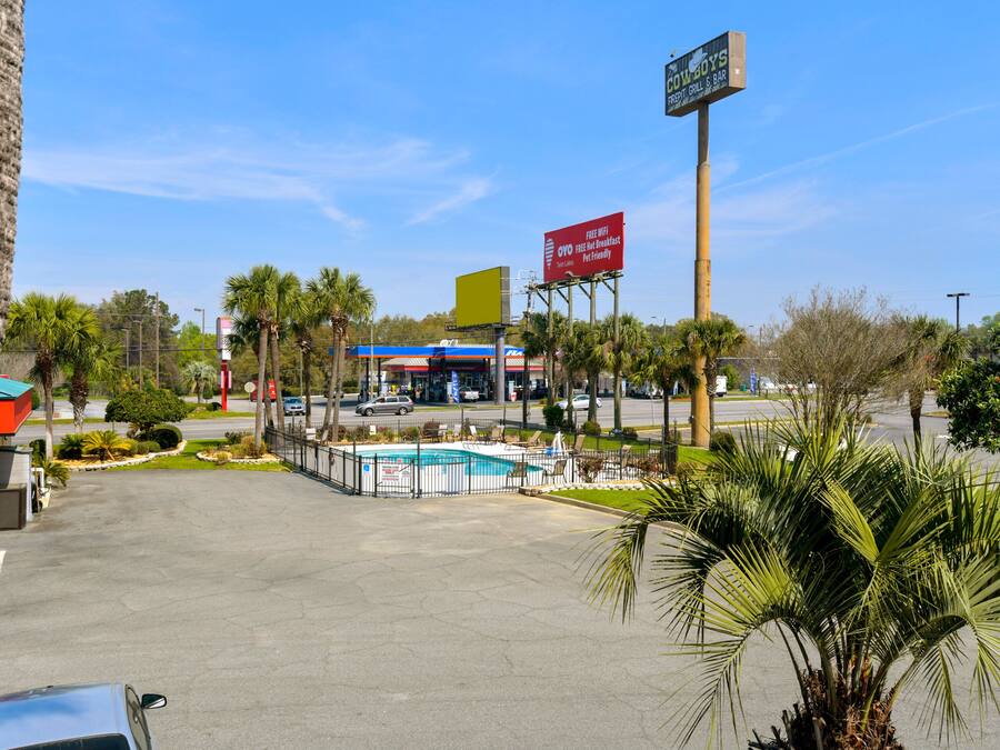 A commercial area with a pool, a restaurant, and a gas station.
