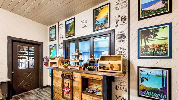 A wooden counter with various food items and a sign that reads "Family." - Americas Best Value Inn Marquette (Marquette)