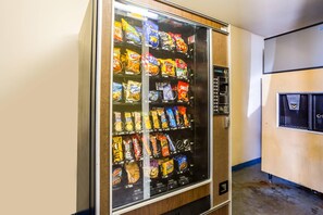 A vending machine with snacks and beverages.