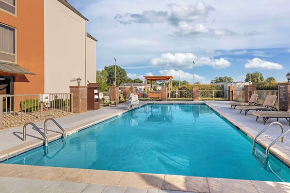 Outdoor pool, open 9:00 AM to 9:00 PM, pool loungers