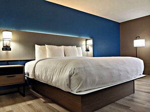 Premium bedding, pillow-top beds, desk, laptop workspace