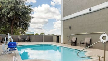 Outdoor pool, open 9:00 AM to 9:00 PM, pool loungers