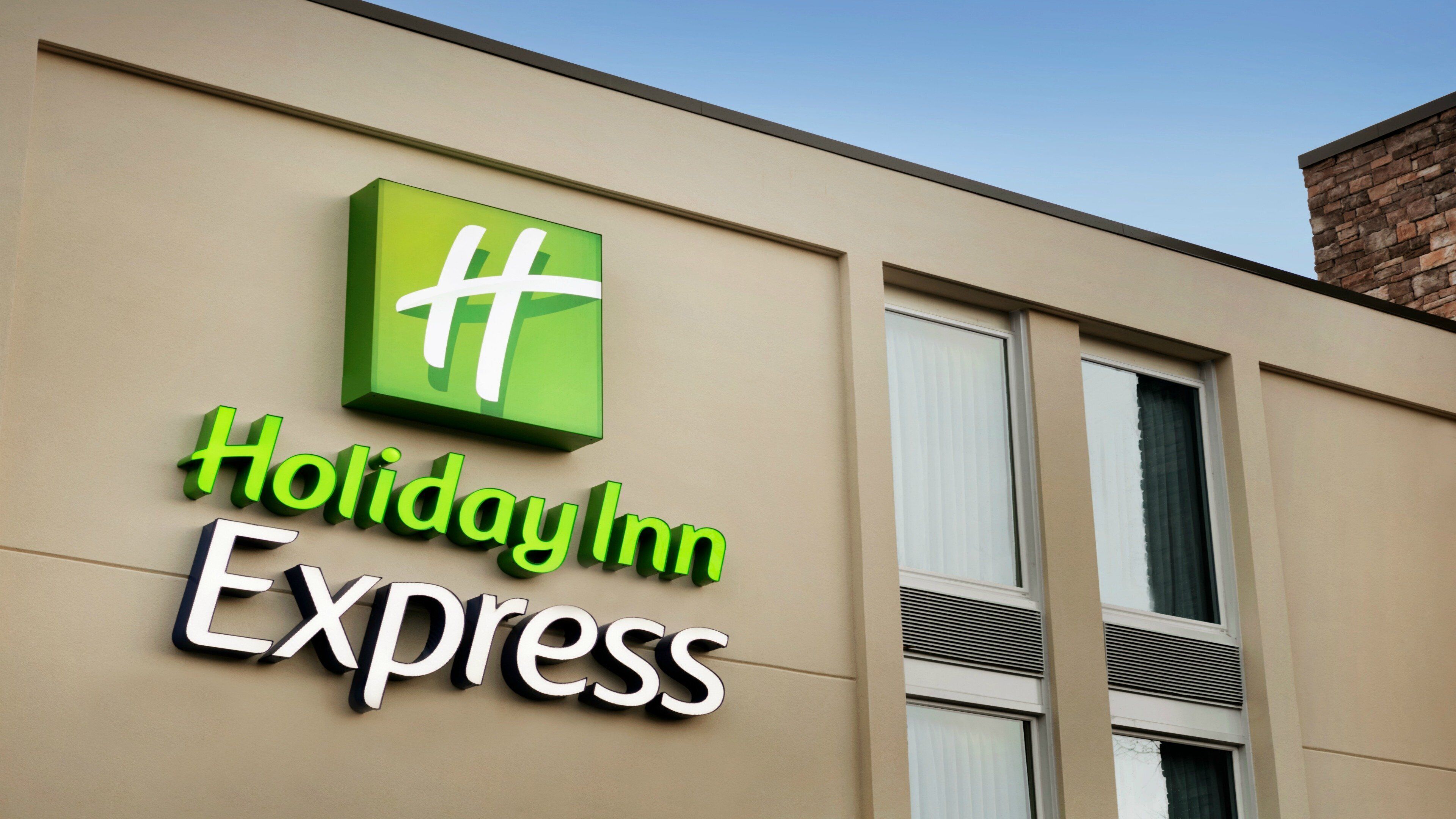 A Holiday Inn Express sign on a building facade.