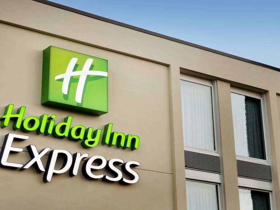 A Holiday Inn Express sign on a building facade.
