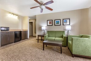 Superior Suite, Bed Room with King Bed, Living Room, Non-Smoking | Premium bedding, laptop workspace, blackout drapes, iron/ironing board
