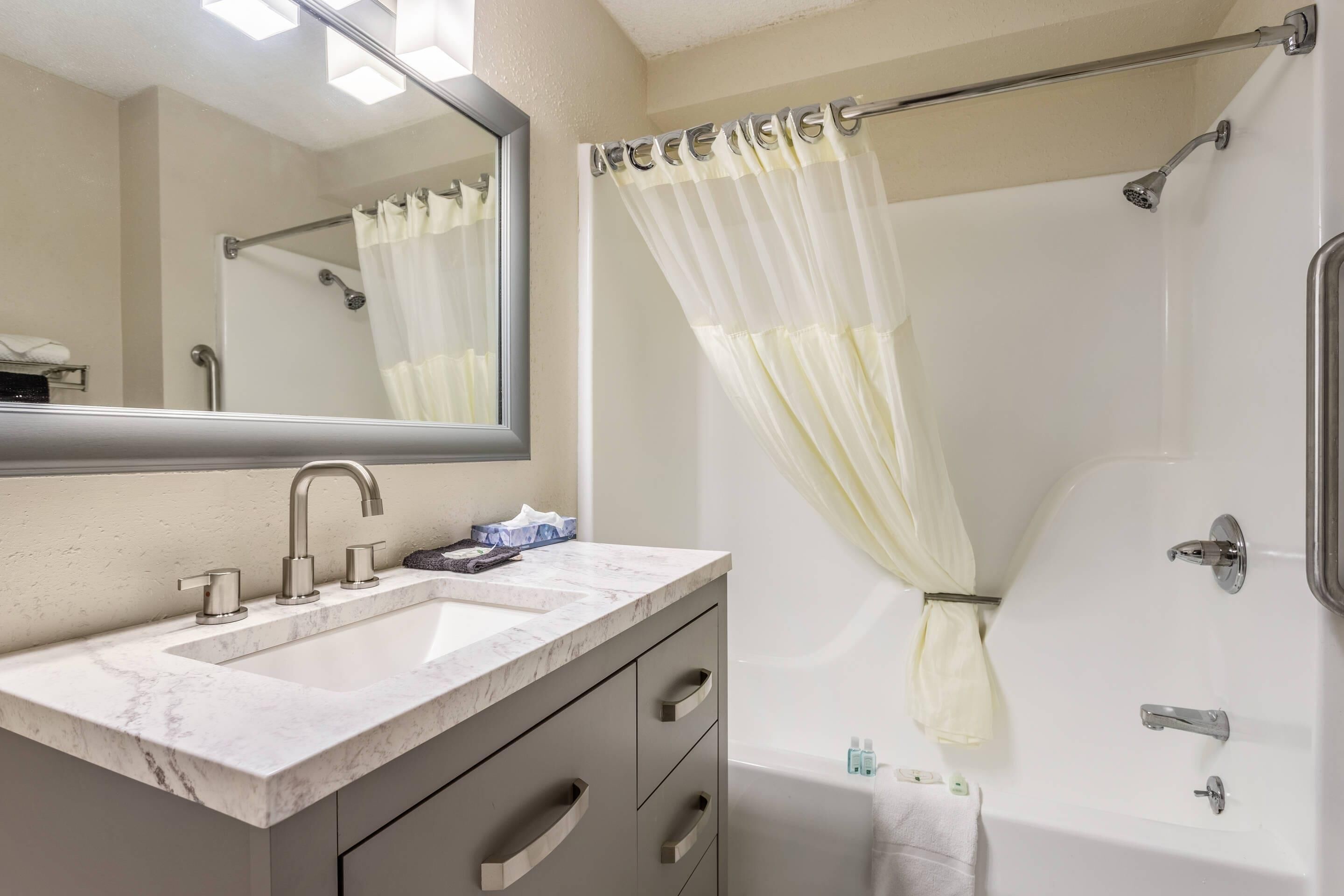 Down comforters, desk, blackout drapes, iron/ironing board