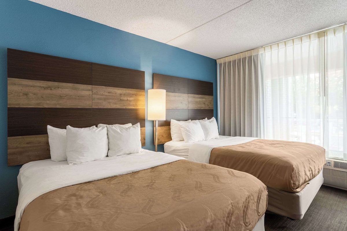 Suite, Multiple Beds, Non Smoking | Down comforters, desk, blackout drapes, iron/ironing board