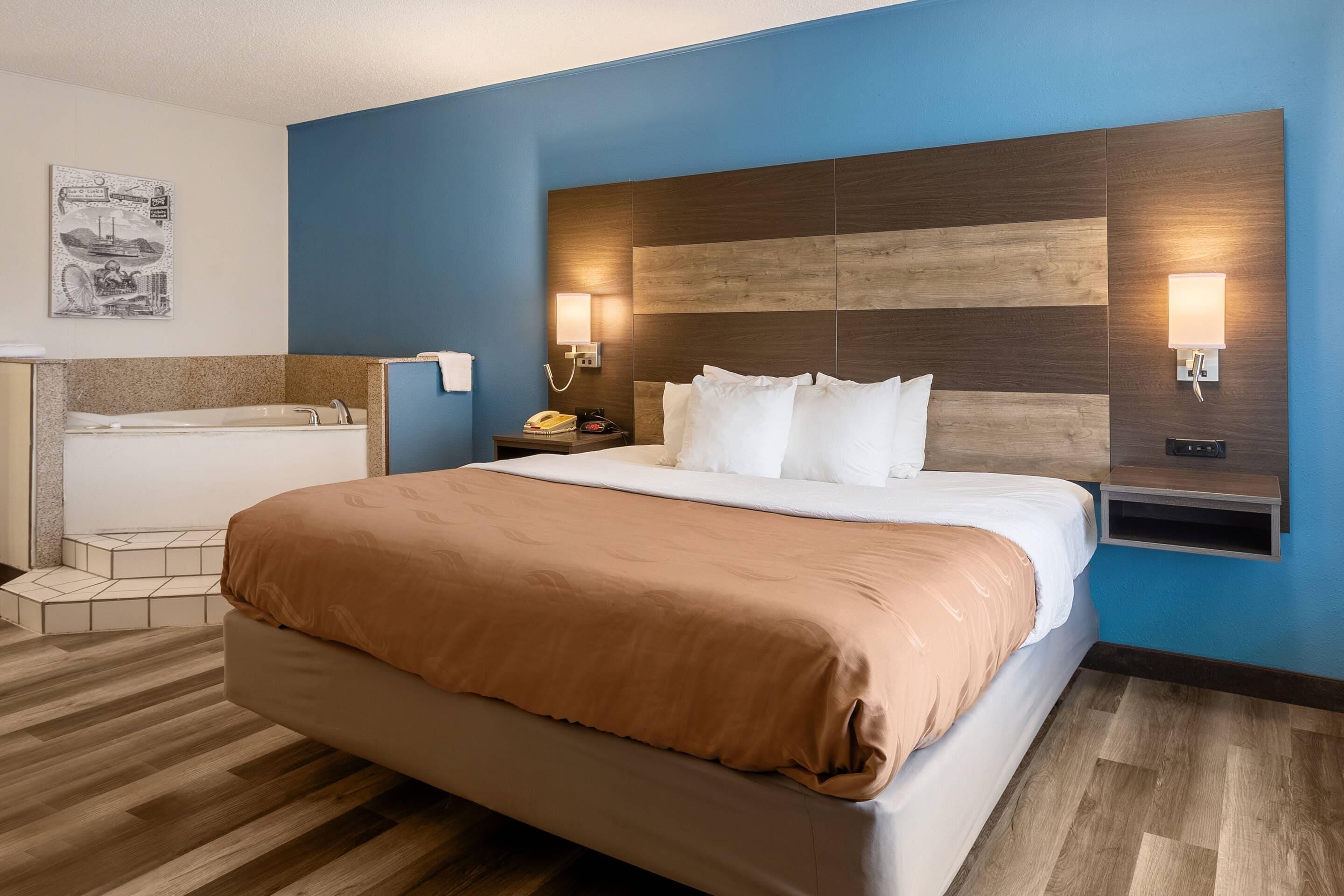 Down comforters, desk, blackout drapes, iron/ironing board