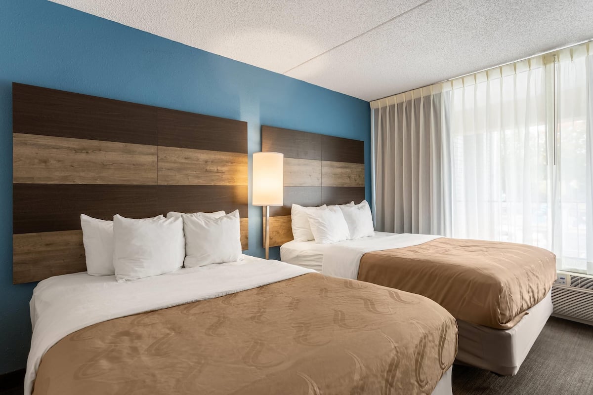 Suite, Multiple Beds, Non Smoking | Down comforters, desk, blackout drapes, iron/ironing board