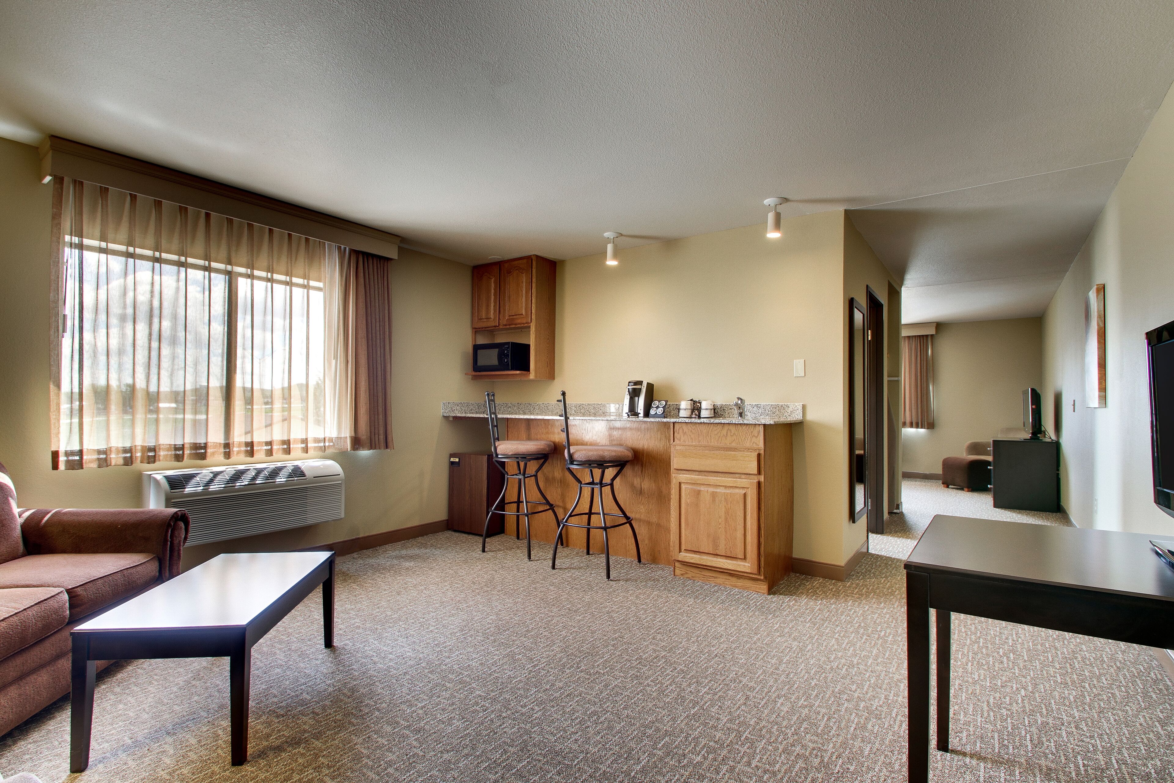 suite, 1 king bed, non smoking, jetted tub | blackout curtains, iron/ironing board, free cots/infant beds