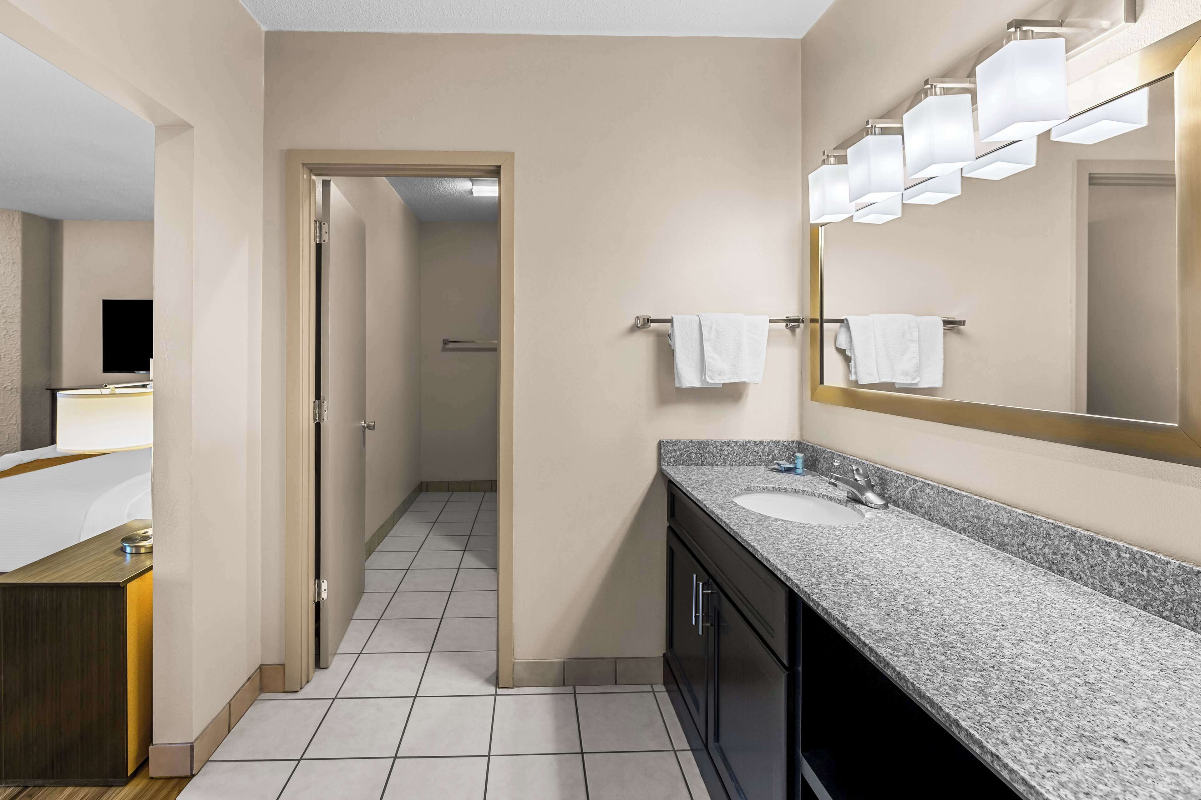 family room, multiple beds, non smoking, refrigerator & microwave | bathroom | free toiletries, hair dryer, towels