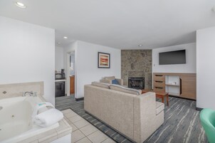 Suite, 1 King Bed, Fireplace, Jetted Tub | Premium bedding, desk, blackout drapes, iron/ironing board