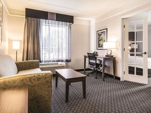 Suite, 1 King Bed, Non Smoking | Living area | Flat-screen TV, video-game console