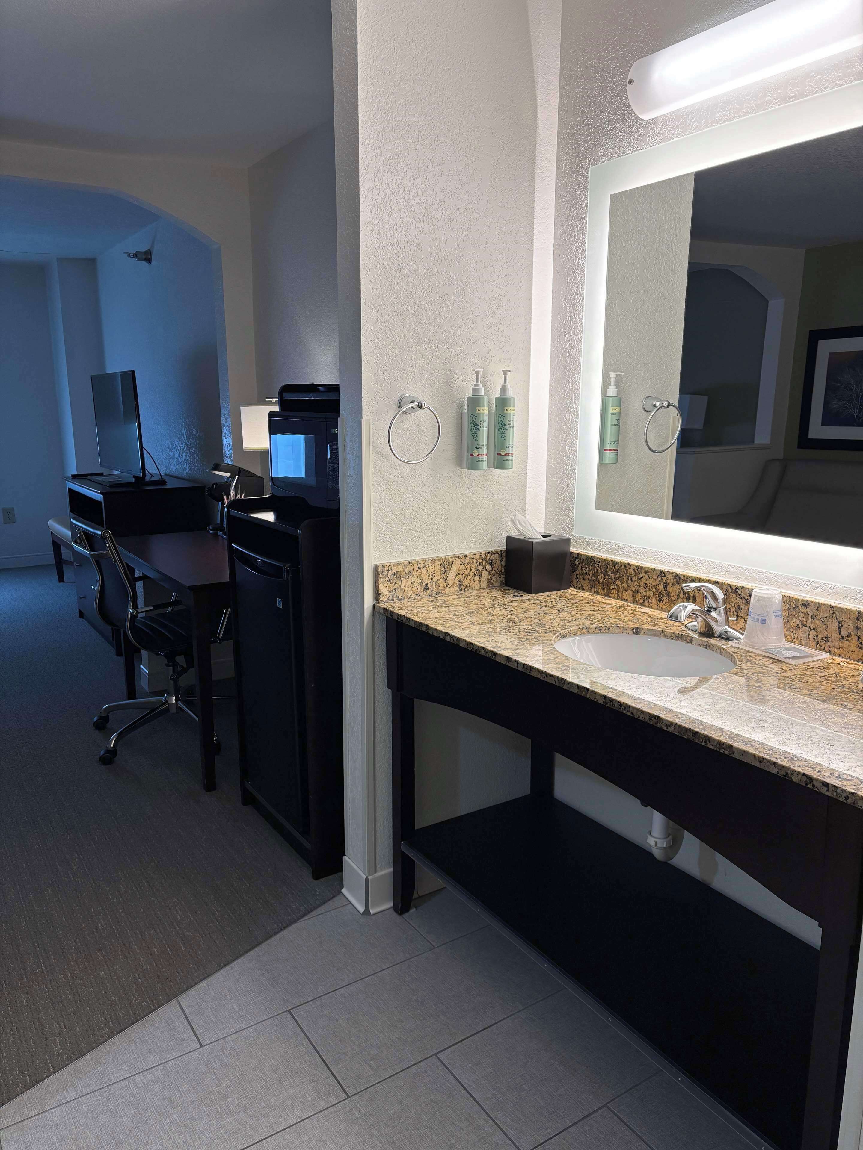 suite, 1 king bed, non smoking, refrigerator & microwave | bathroom | combined shower/bathtub, free toiletries, hair dryer, towels