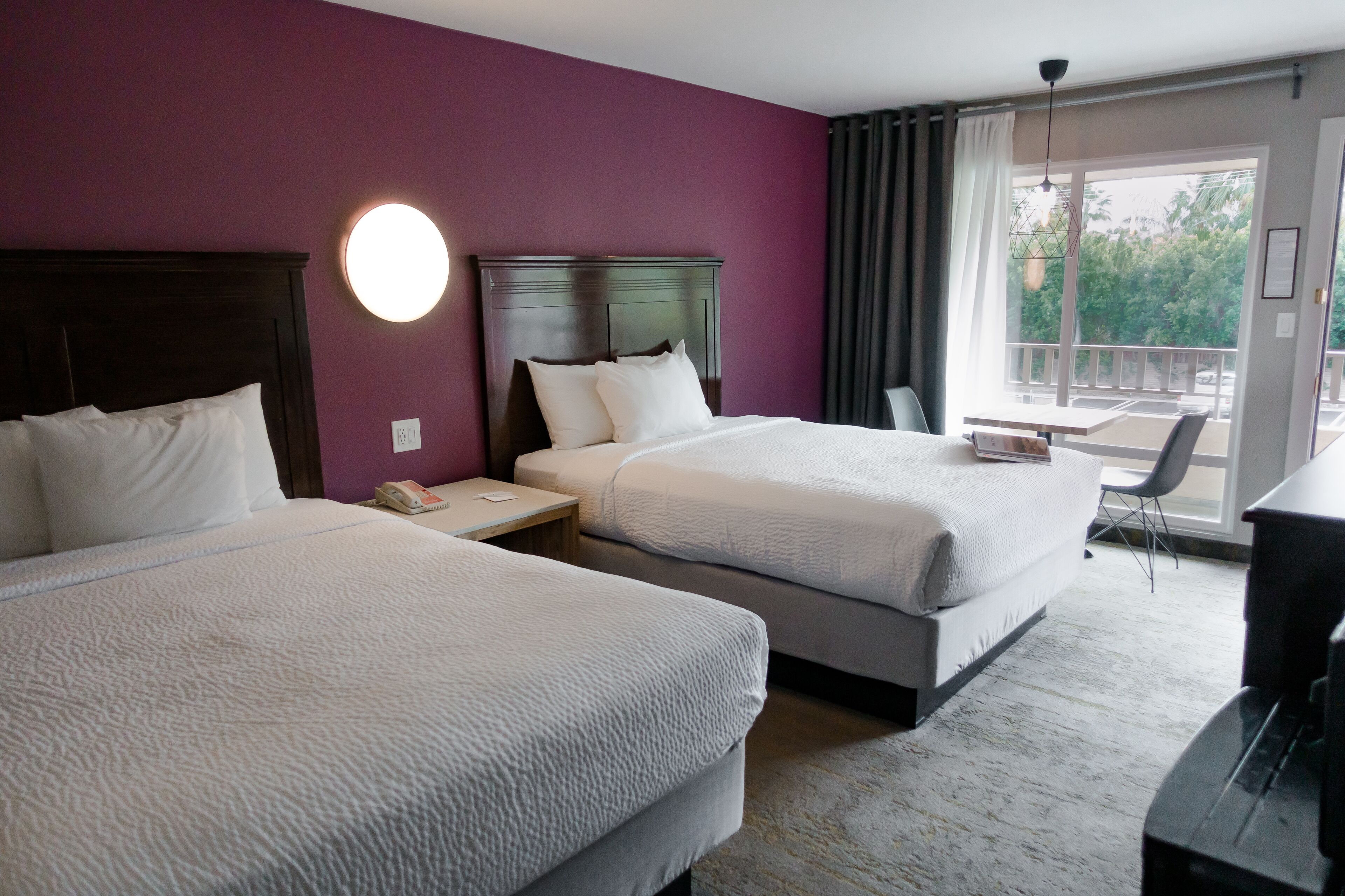 deluxe double room, 2 queen beds, pool view | in-room safe, desk, free wifi, bed sheets