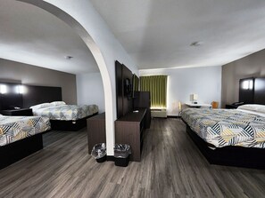 A hotel room with two beds, a desk, a chair, and a TV. - Motel 6 Pine Bluff, AR (Pine Bluff)