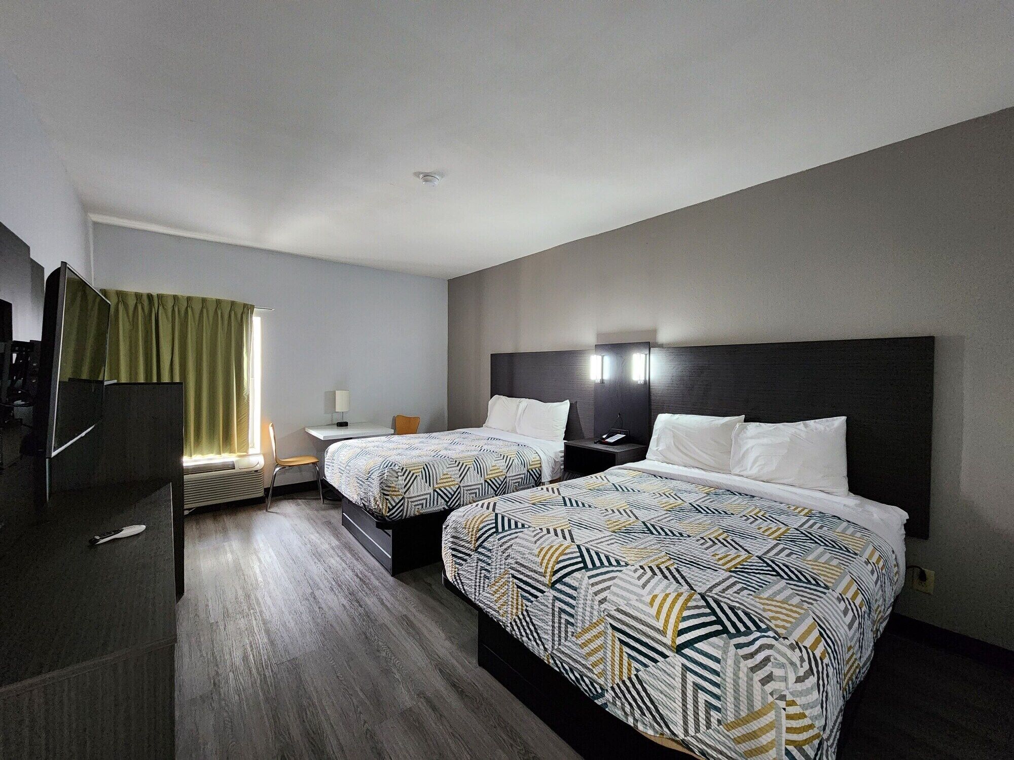 Premium bedding, desk, laptop workspace, free WiFi