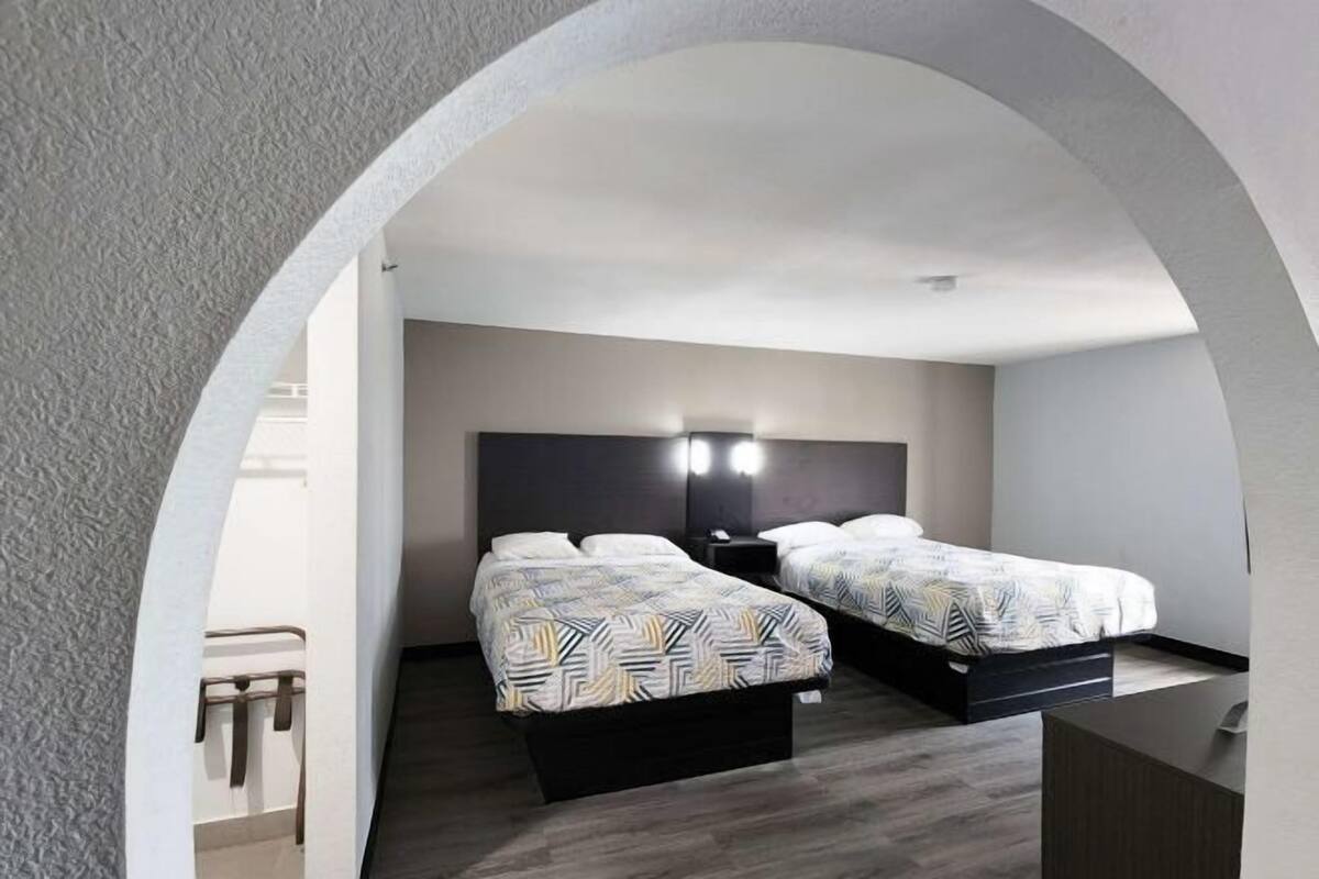 Premium bedding, desk, laptop workspace, free WiFi