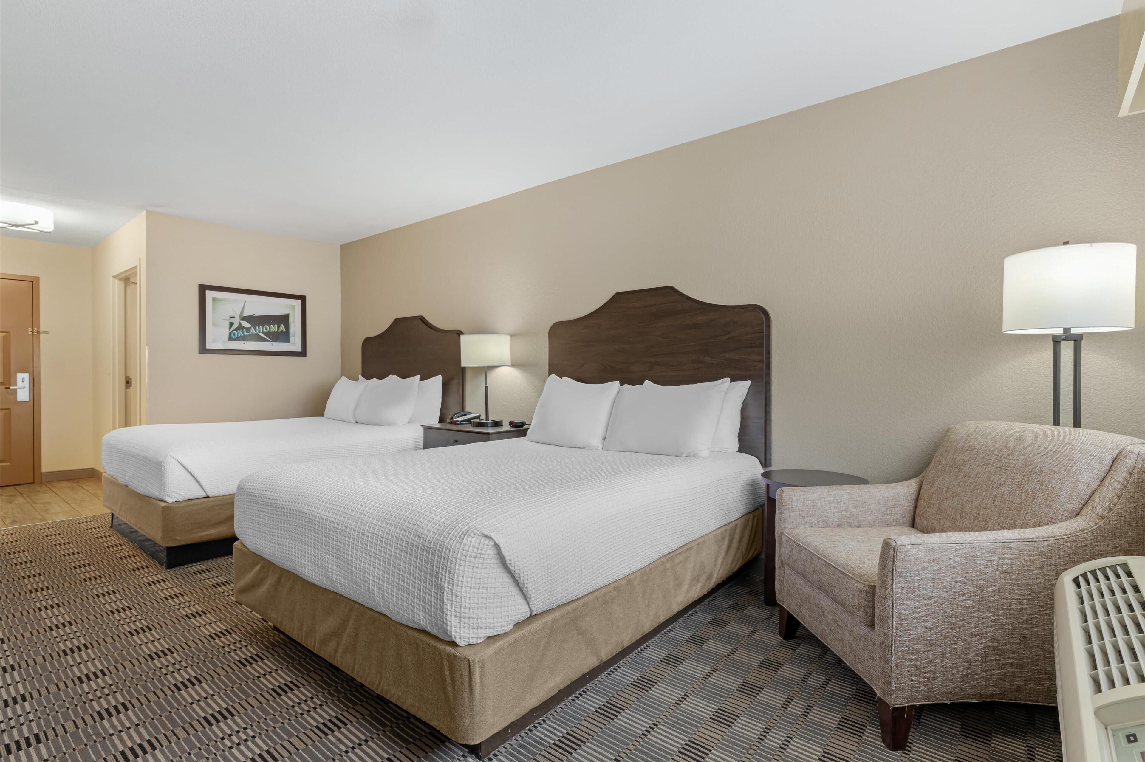 standard room, 2 queen beds, non smoking, refrigerator & microwave | desk, soundproofing, iron/ironing board, rollaway beds