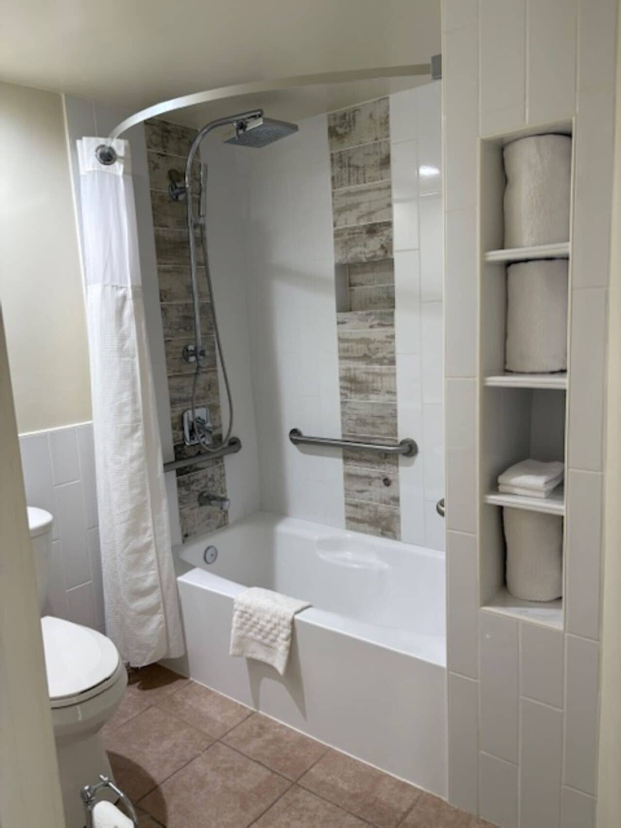 standard room, 1 king bed, accessible, refrigerator & microwave | bathroom | combined shower/bathtub, rainfall showerhead, free toiletries