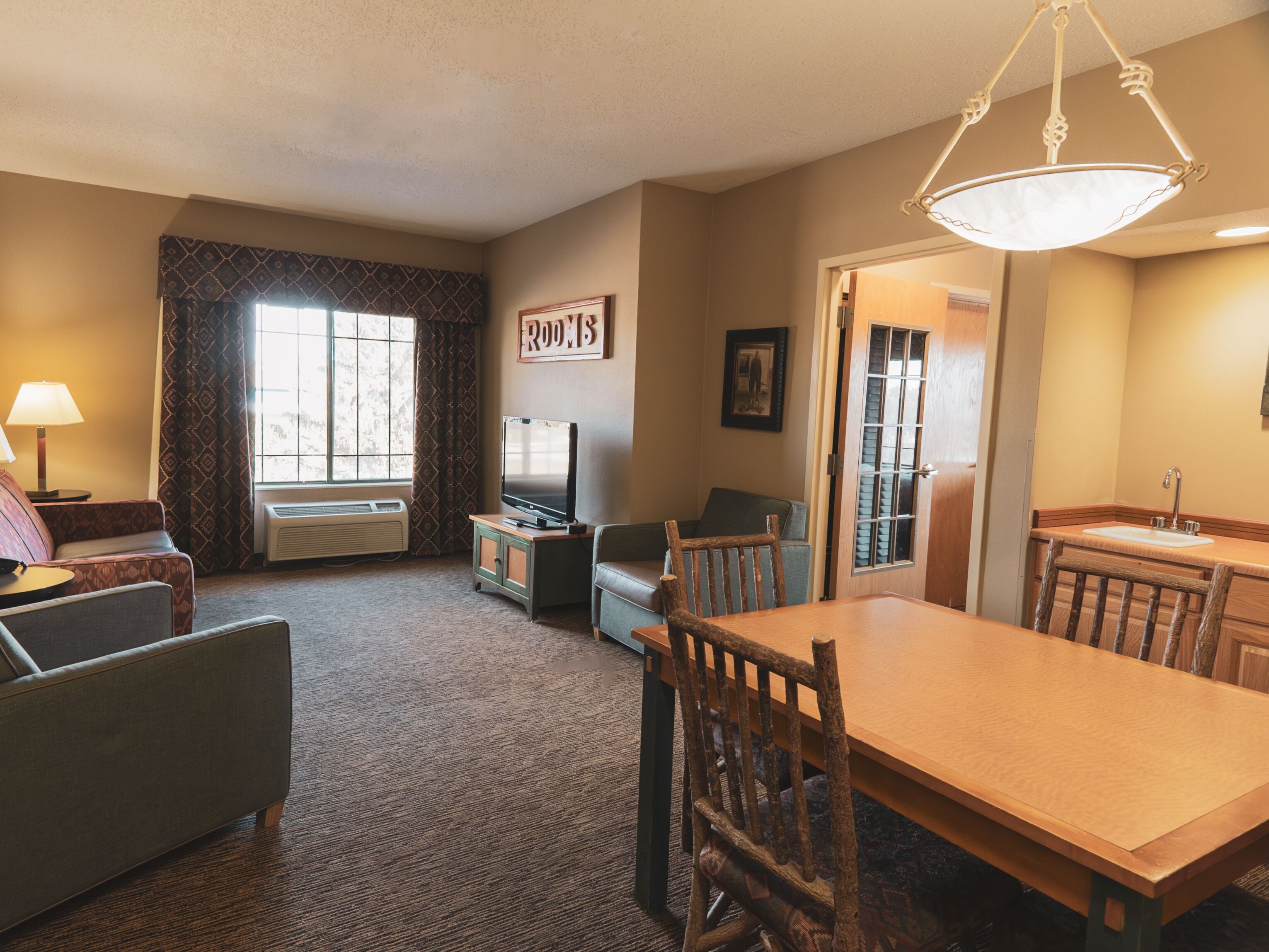 double queen corner suite | living area | flat-screen tv, dvd player