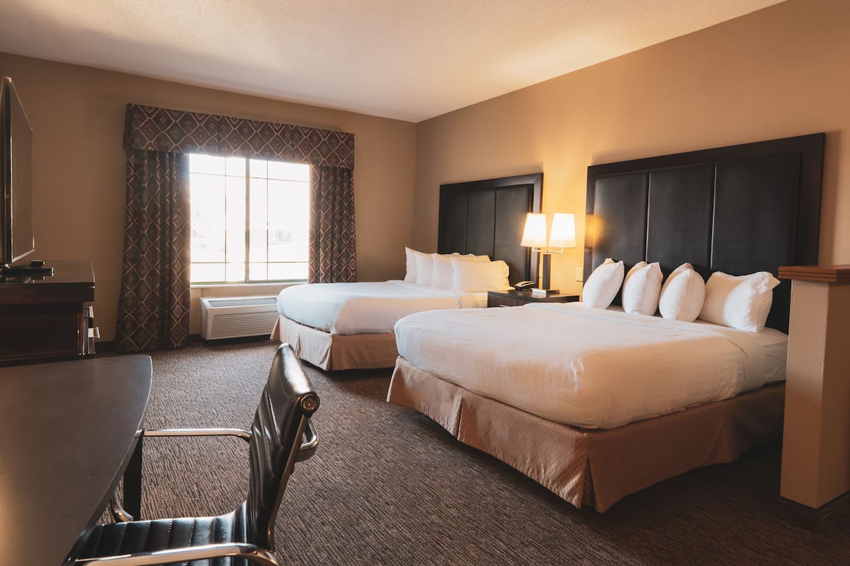 Double Queen Corner Suite | 1 bedroom, desk, laptop workspace, blackout drapes