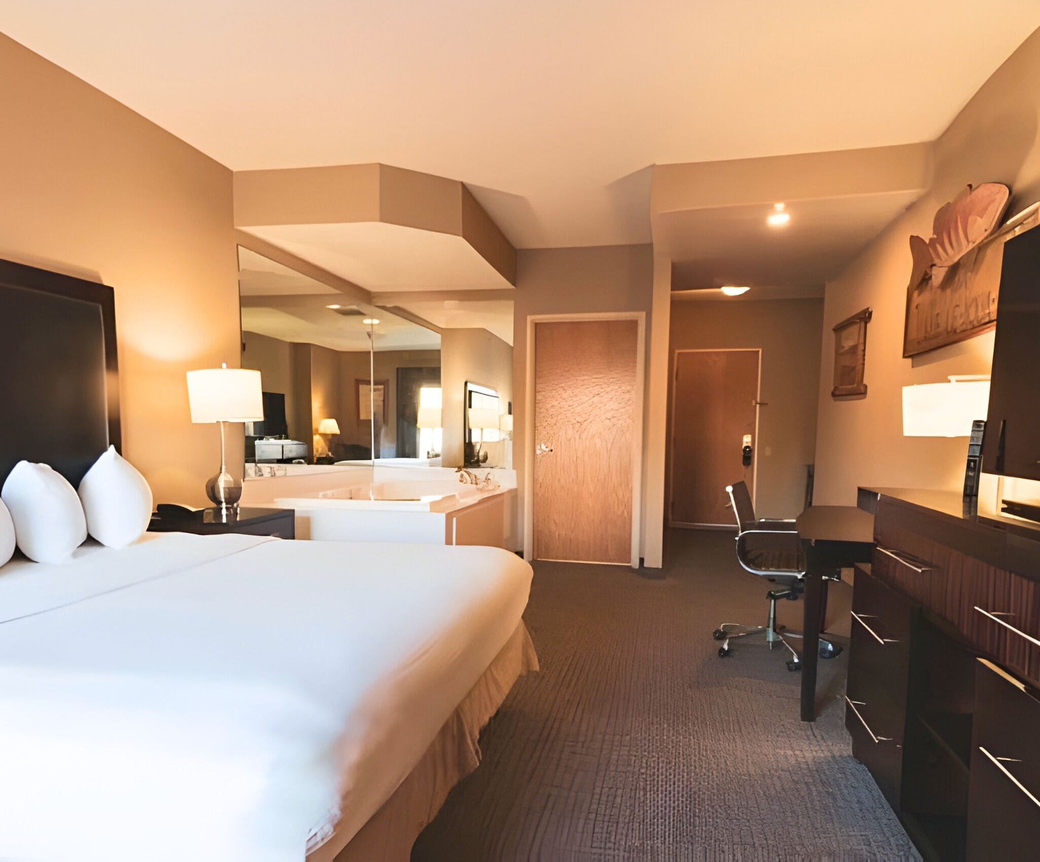 King Whirlpool Suite Accessible | Desk, laptop workspace, blackout drapes, iron/ironing board