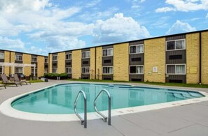 Seasonal outdoor pool, open 10:00 AM to 9:00 PM, pool umbrellas