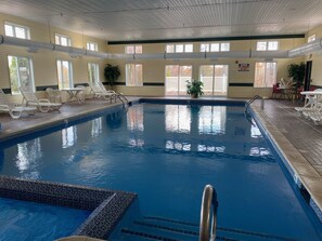 Indoor pool, open 9:00 AM to 9:00 PM, pool loungers