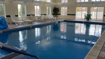 Indoor pool, open 9:00 AM to 9:00 PM, pool loungers