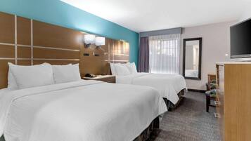 Desk, iron/ironing board, bed sheets