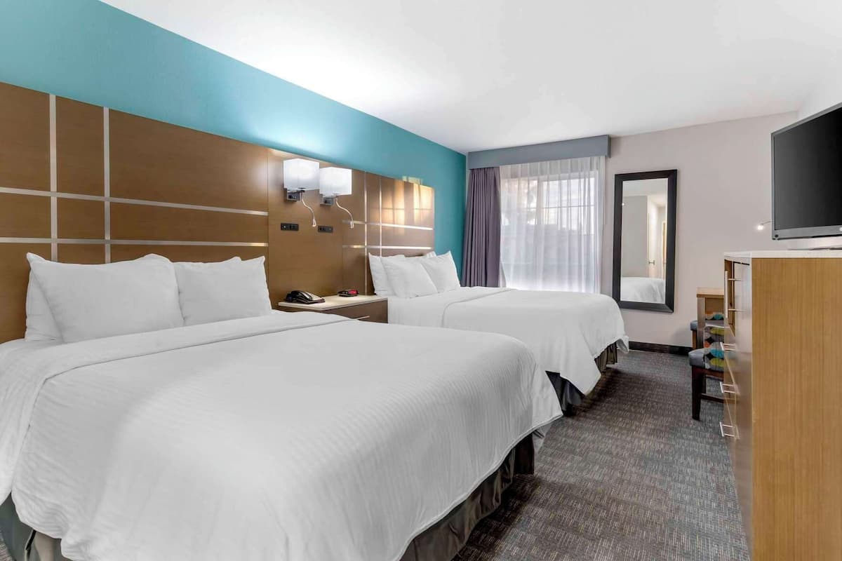 Desk, iron/ironing board, bed sheets