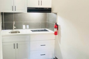 Suite, 1 King Bed, Non Smoking (Efficiency) | Premium bedding, desk, blackout drapes, iron/ironing board - Quality Inn & Suites near Robins Air Force Base (Warner Robins)