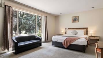 Desk, laptop workspace, blackout curtains, iron/ironing board