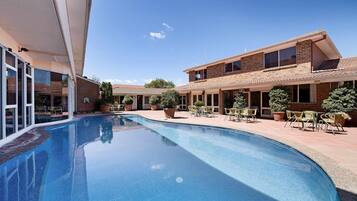 Outdoor pool, open 7:00 AM to 10:30 PM, pool loungers