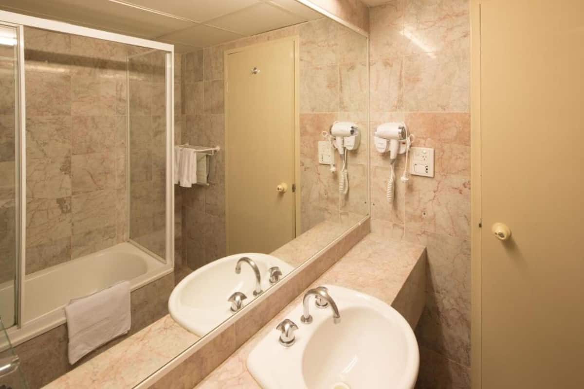 superior room, 2 queen beds | bathroom | shower, rainfall showerhead, eco-friendly toiletries, hair dryer